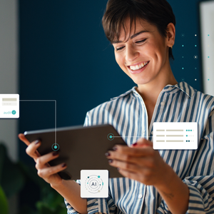 A woman looks smiling at her screen and a logo in the upper left corner says AI