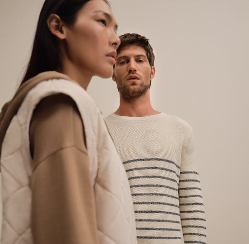 A man and a woman wearing Tom Tailor outfits