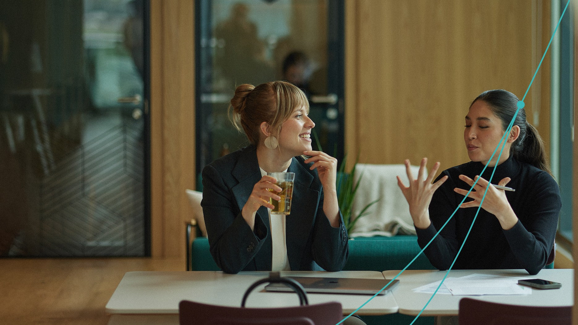 Two women talking at Retraced