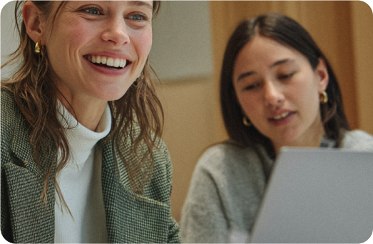 Female managers discussing happily where we go